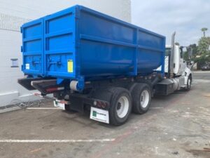 A truck with a blue trailer