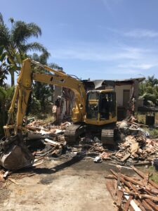 A crane vehicle collecting the debris